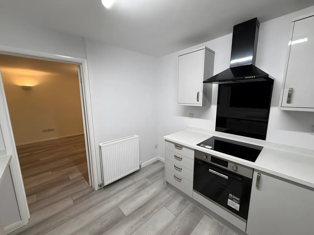 Kitchen with freshly painted white walls after a renovation