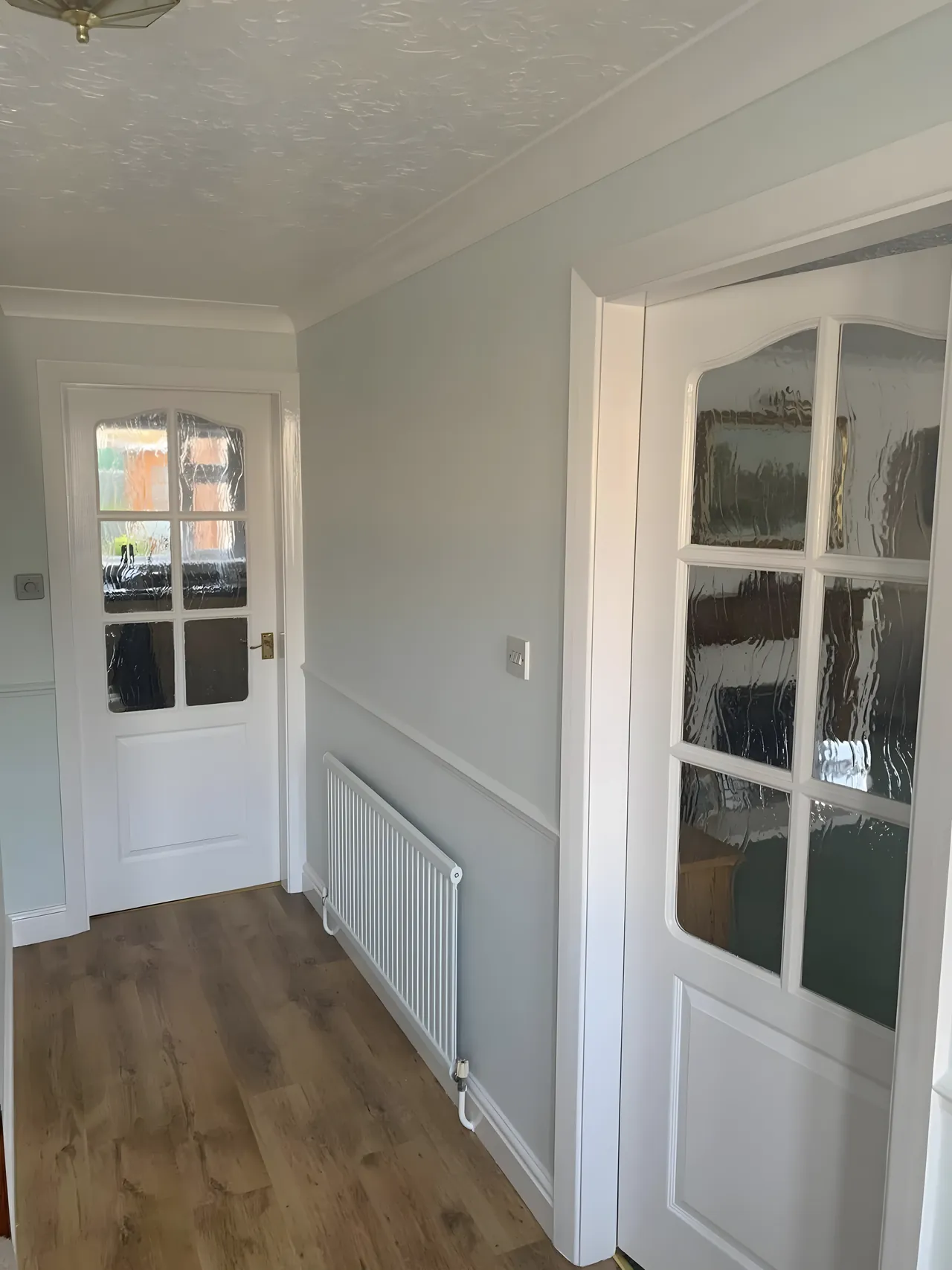 Rental property hallway freshly painted between tenants