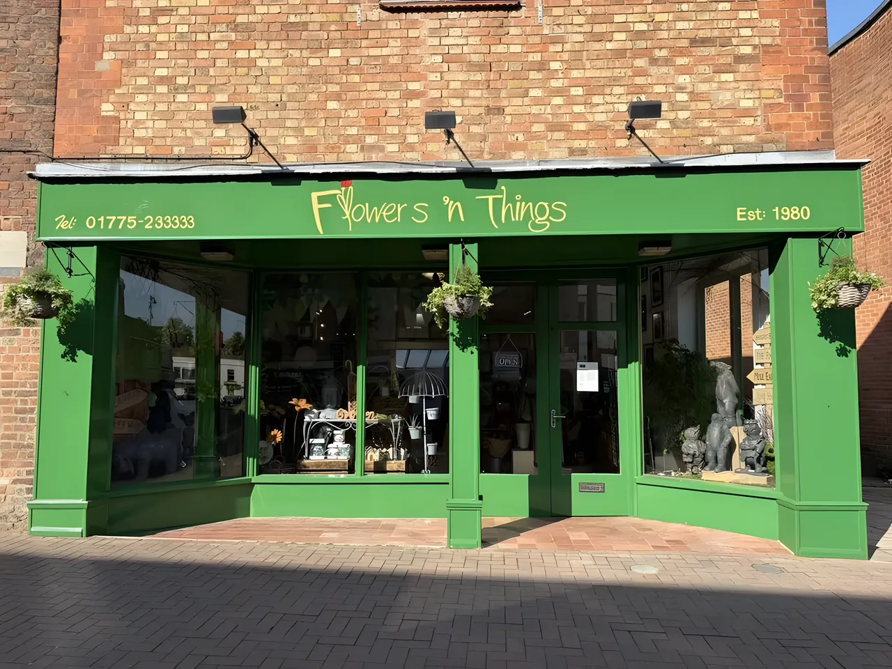Green shop front repainted in Spalding town centre